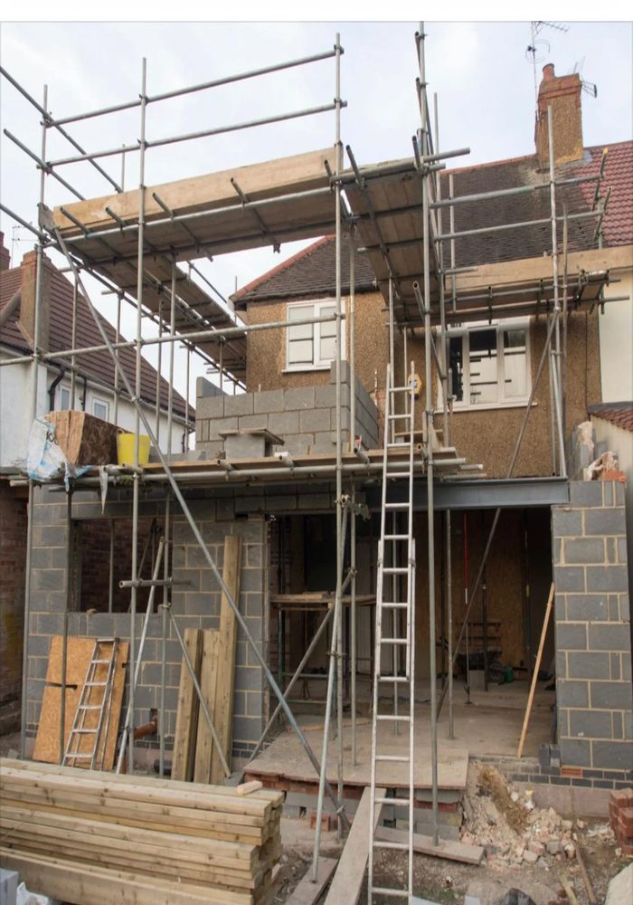 Double-storey house extension under construction with scaffolding - All Aspects Construction