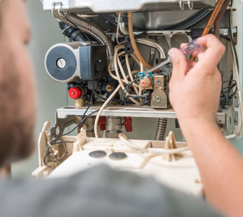 Plumber resolving leak