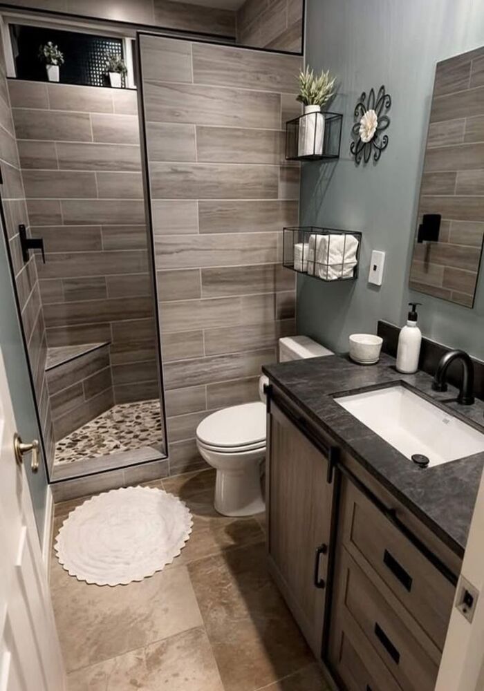 Modern dark-tiled bathroom — Cardiff & Caerphilly Construction