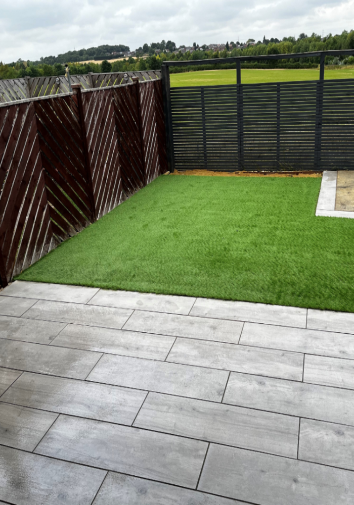 Artificial lawn with paved patio and fencing — Cardiff & Caerphilly Construction