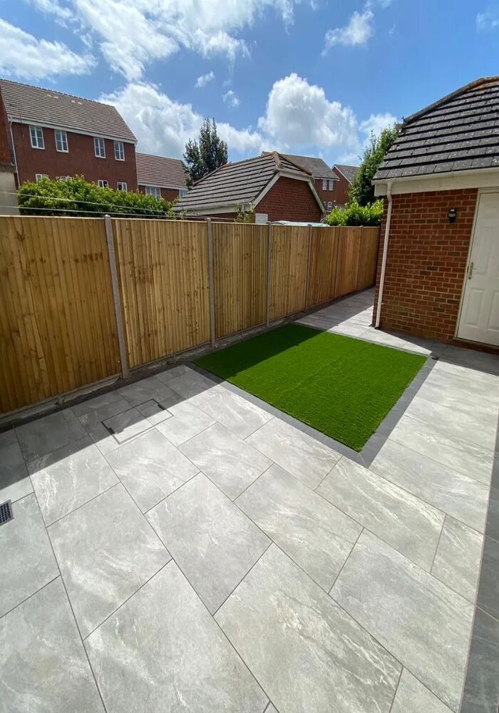 Paved garden patio with lawn and fencing — Cardiff & Caerphilly Construction